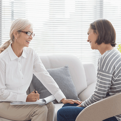 Therapits and patient sitting together